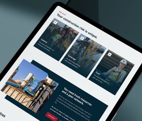 A photo of an ipad with the ACIG website on it